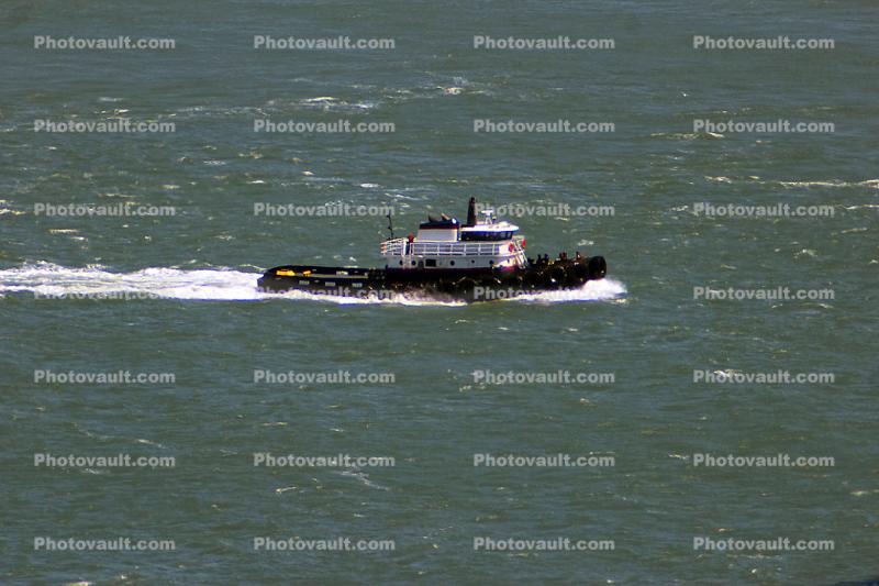 Tugboat pulling the USS Iowa