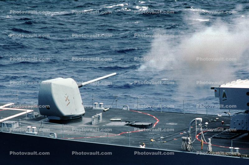 Firing the Mk 45 5-inch/54 caliber lightweight gun, USS Harry W Hill (DD 986), Spruance-class destroyer
