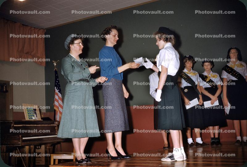 Girl Scouts receiving badges