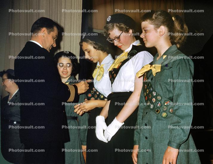 Girl Scouts receiving badges