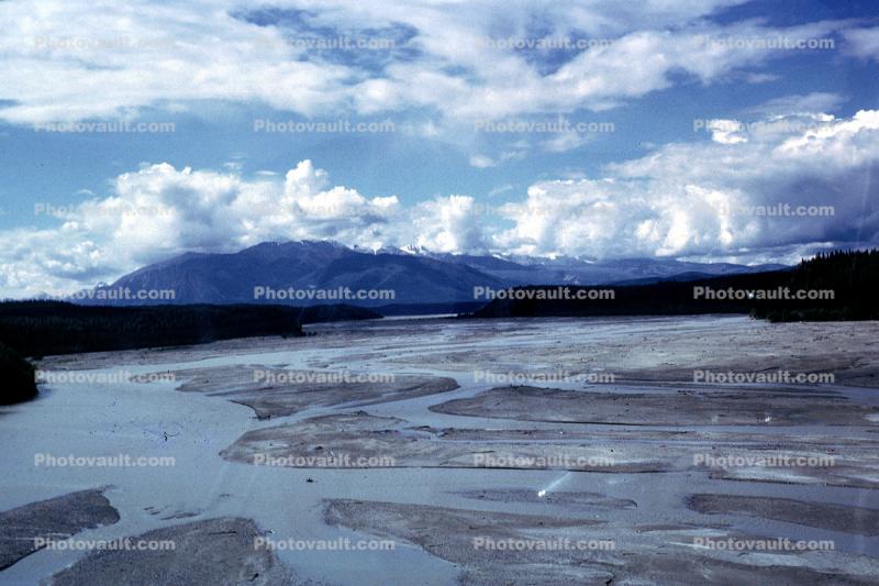 River, wetlands, mud flats, clouds