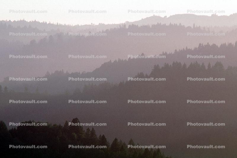 layered mountains, hills, haze
