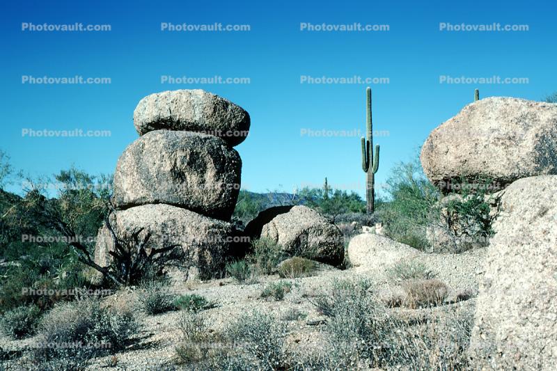rock outcropping, cactus, stacked boulders, butte