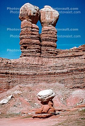 HooDoo Twin Sisters, and a lone Mexican Man Sitting, Spire, Sandstone