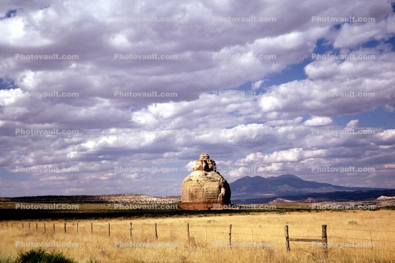Beehive Rock, Cumulus Clouds, fence