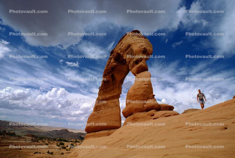 Delicate Arch, clouds, person, hiker, walker, geologic feature, geoform