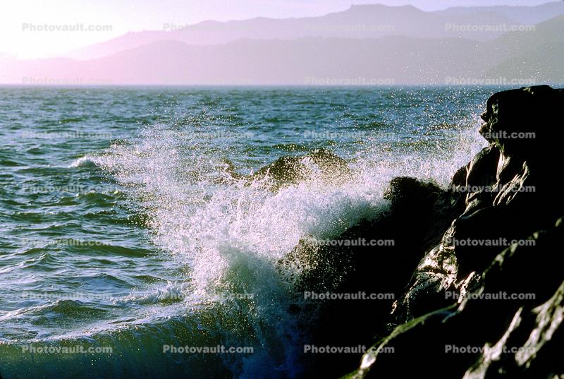 wave onto the shore rocks