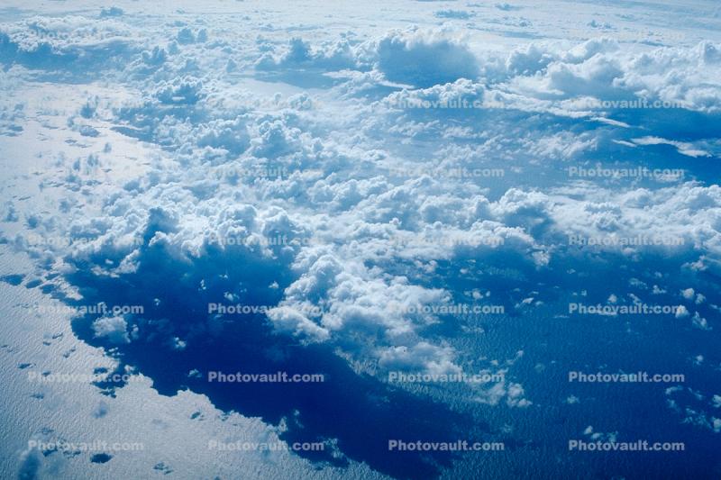 Flying over the Ocean, daytime, daylight, Cumulus Cloud Puffs, puffy, ocean