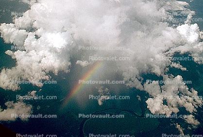 Looking down on a rainbow, cumulus cloud