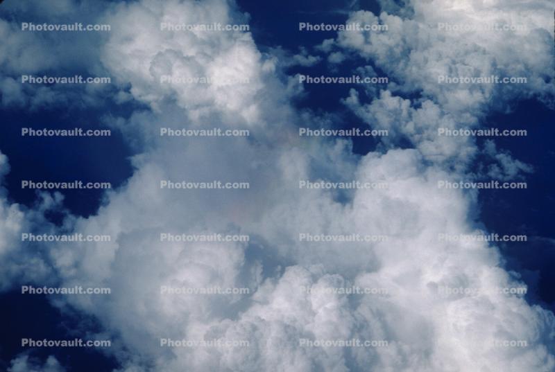 Pacific Ocean flying from California to Japan, daytime, daylight, Cumulonimbus, Cumulus Cloud Puffs