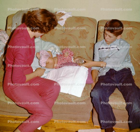 Diaper Change, Mother, Brother feeding baby, 1950s