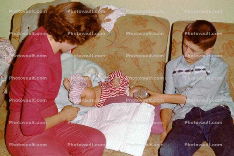 Diaper Change, Mother, Brother feeding baby, 1950s