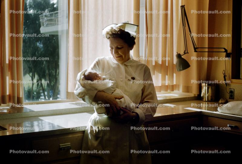 Nurse with Newborn Baby, Maternity Hospital, 1950s, Childbirth