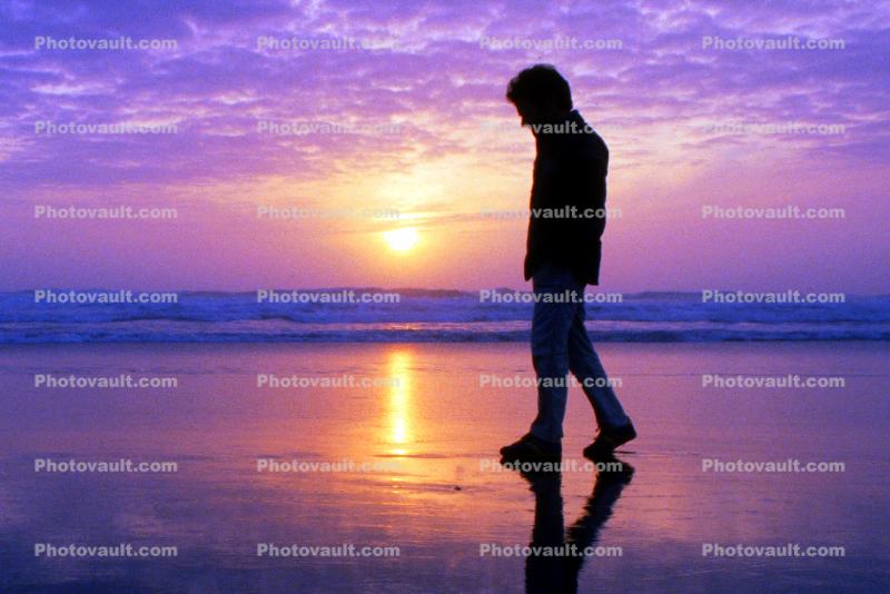 Man Walking in the Ocean Sunset