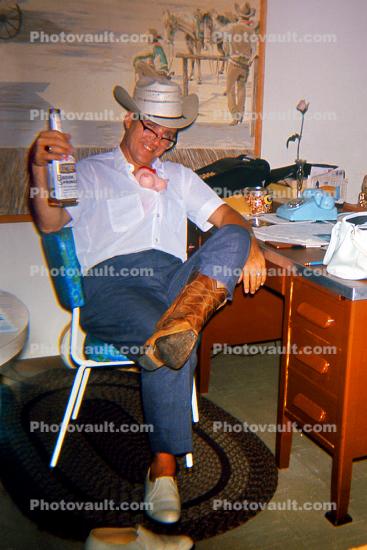 Man, Cowboy Boots, Hat, Jeans, Chair, Brook Springs Whisky Bottle, Goofing, desk, rug, Kentucky Derby Party