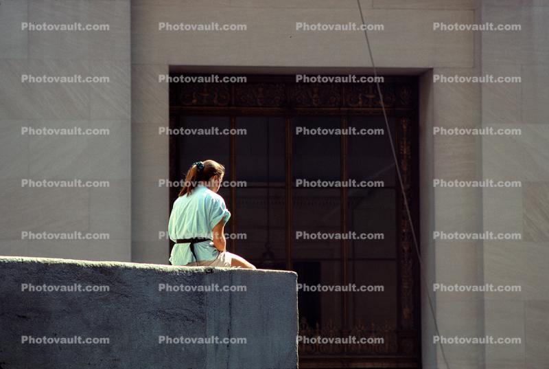 Lonely Woman Sitting in a Concrete Jungle