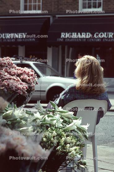 Woman Sitting in a Chair Outside, Hair