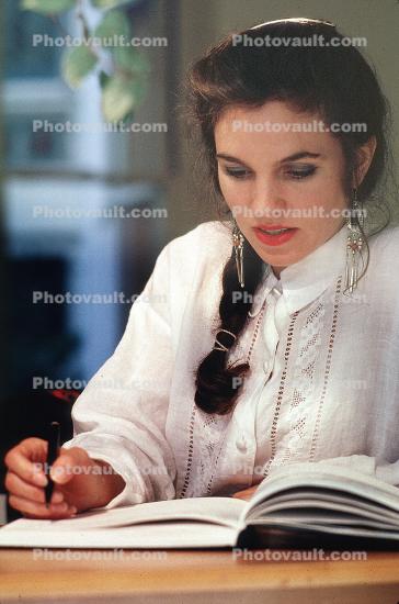 Woman writing into her Diary