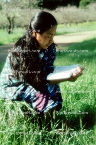 Woman Reading a Book Outdoors