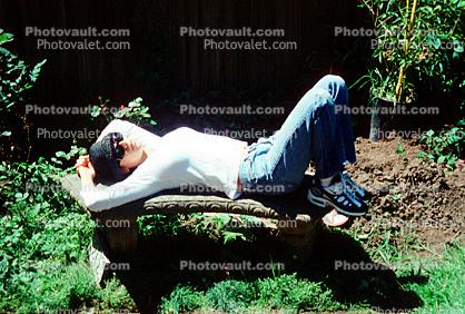Woman Relaxing on a Curved Bench