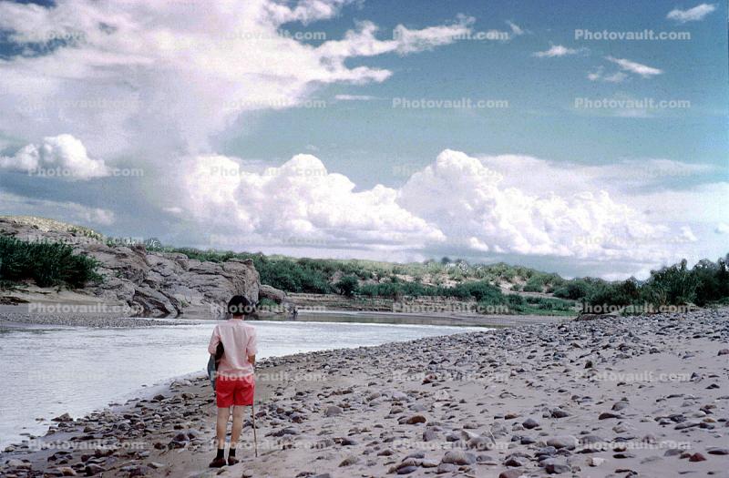 Rio Grande River, Texas, Beach, rocks, stones, clouds, woman, shorts