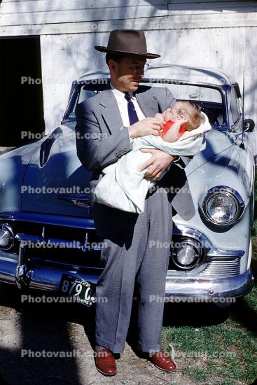 Grandpa, grandson, Chevy car, Chevrolet, hat, swaddled, 1950s