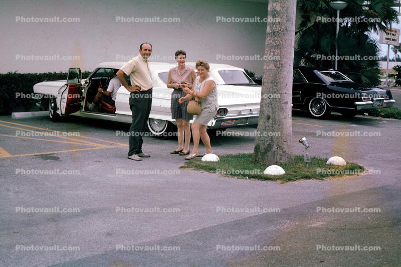 Cadillac, car, women, man, parking, August 1964, 1960s