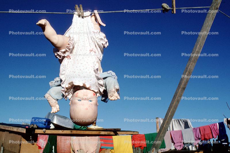 upside-down doll, clothesline, clothespins