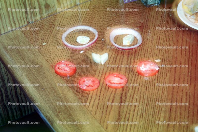 tomato and onion face on a table, Pareidolia