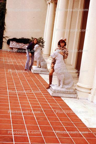Ladies with Dog Sculptures, red tile floor