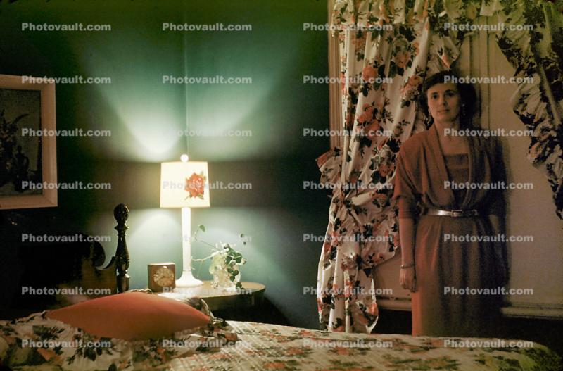 Woman, Lamp, night table, bed, curtains, 1940s