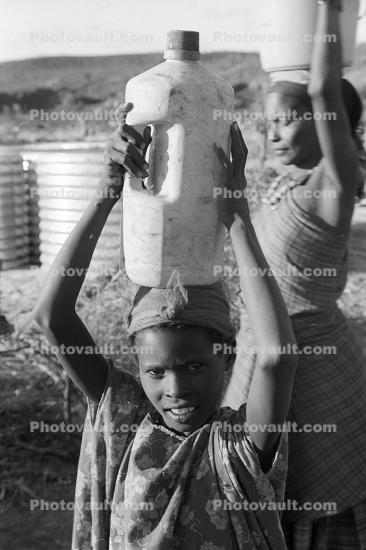 Women carry water, Somalia Refugee Camp