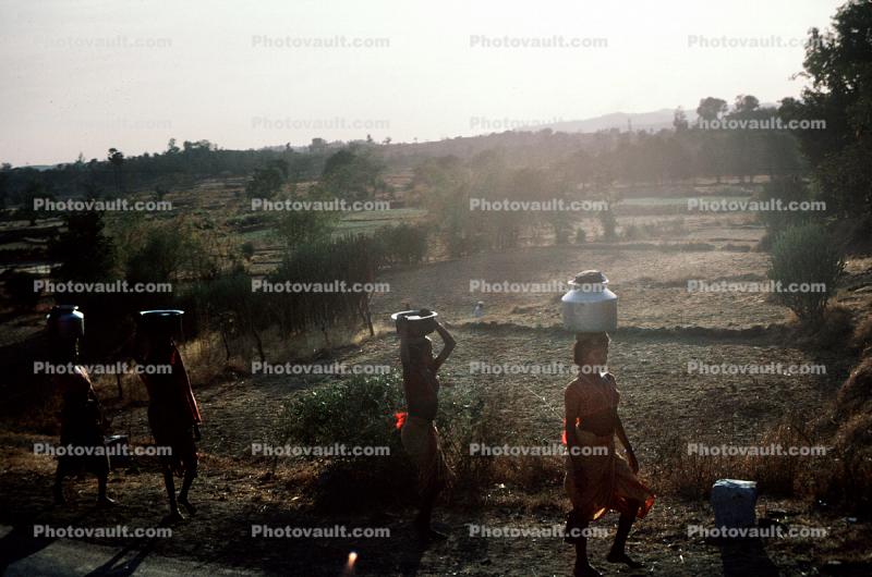 Women carrying water, India