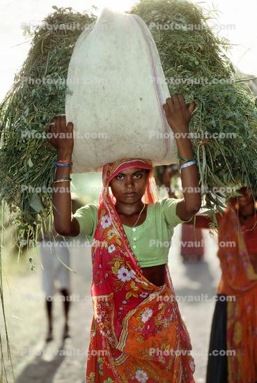 Girl Carrying a Heavy Load