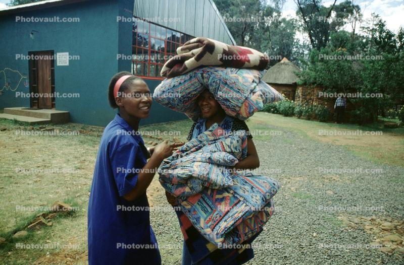 Woman Carries Blankets and Pillows, Lesotho Africa