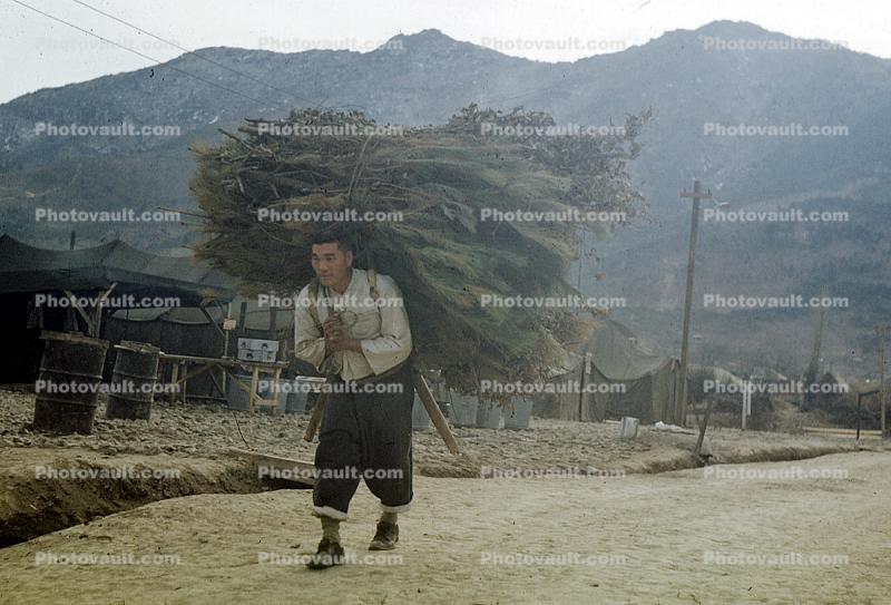 Many carrying a bushel, overload, 1960s, Pusan, South Korea
