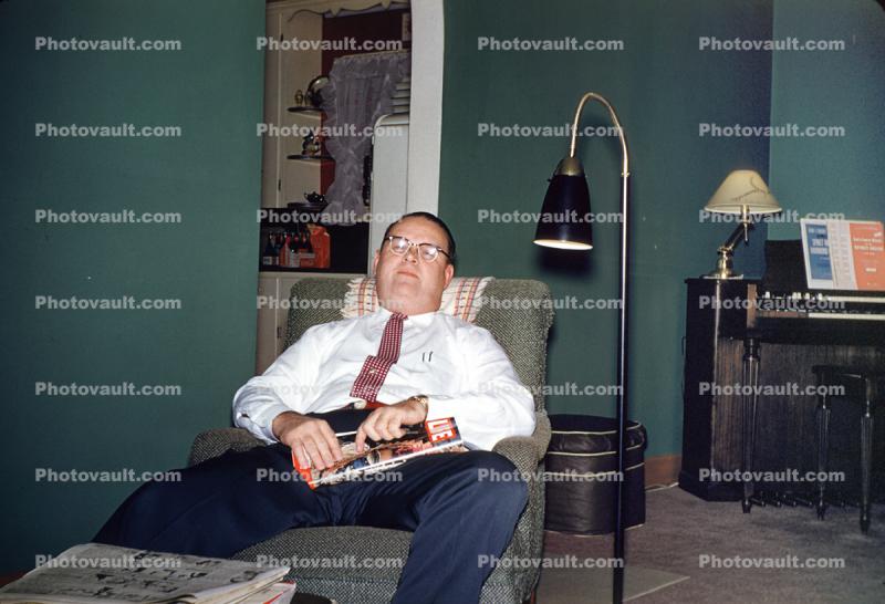 Man Falls ASleep Reading Life Magazine, lamp, walls, 1950s