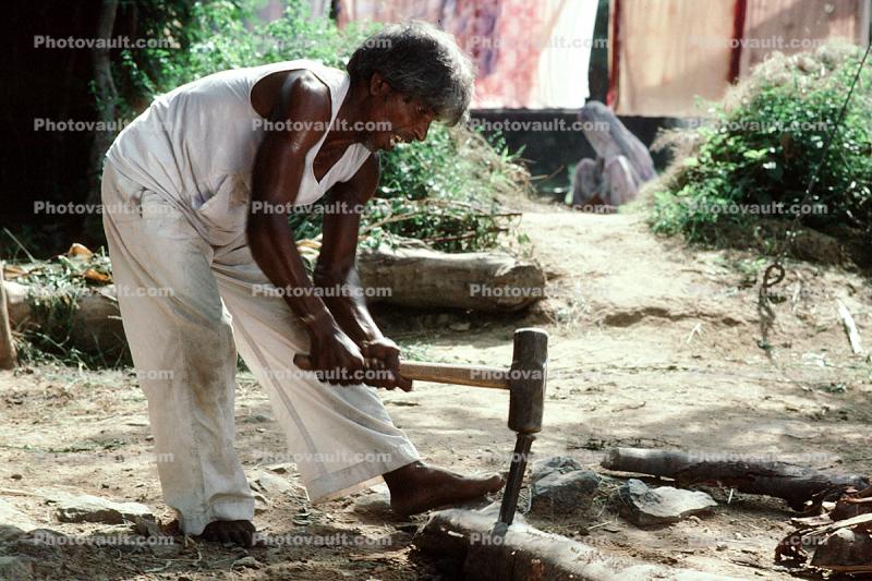 India, Man with Hammer and Spike