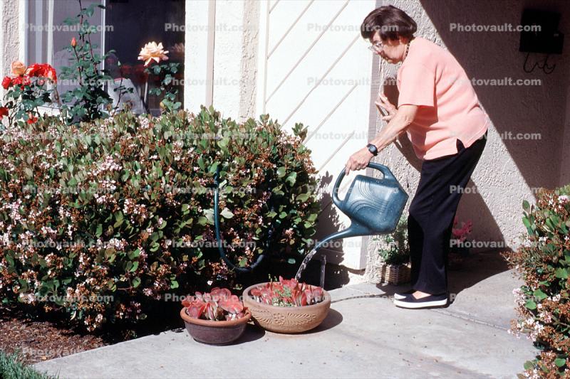 Woman watering her flowers