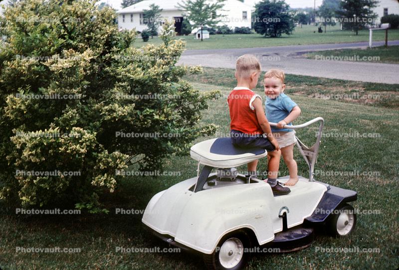 Boys on a lawnmower