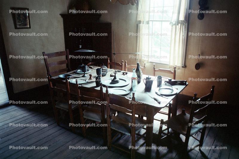 Table, Plates, setting, chairs, knife, wine bottle