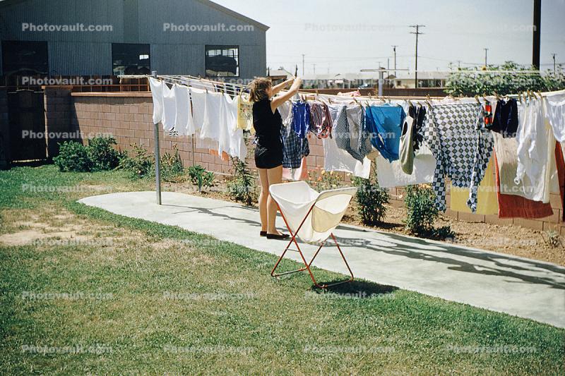 Backyard Drying Line, Hanging clothes, drying, woman, 1950s
