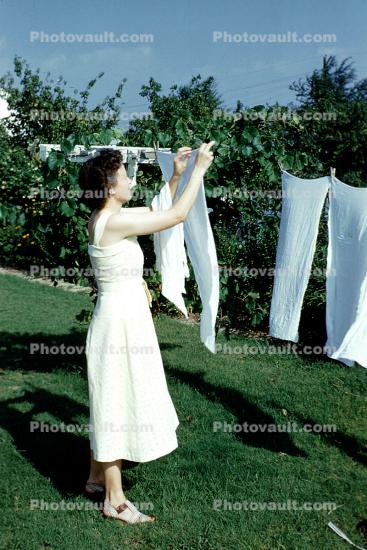 1950s housewife, Hanging clothes, clothesline, backyard, Drying Line, Clothes Line