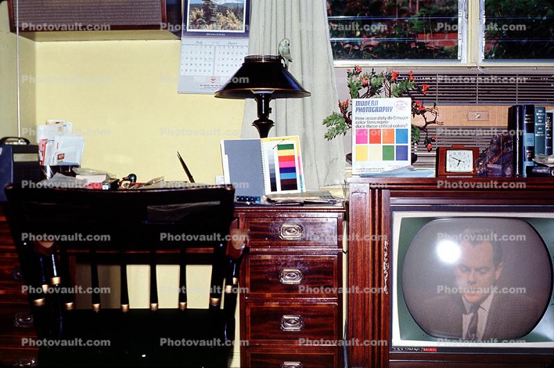 Television Screen, lamp, color chart, lampshade, desk, clock, drawers, books, 1960s