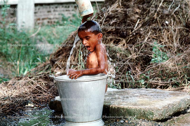 bathing, water boy, washing, cleaning, pail, bucket, sunny, outside, ourdoors, exterior, funny, cute, hilarious