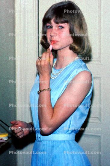 Teen Girl putting on Lipstick, Primping, 1960s