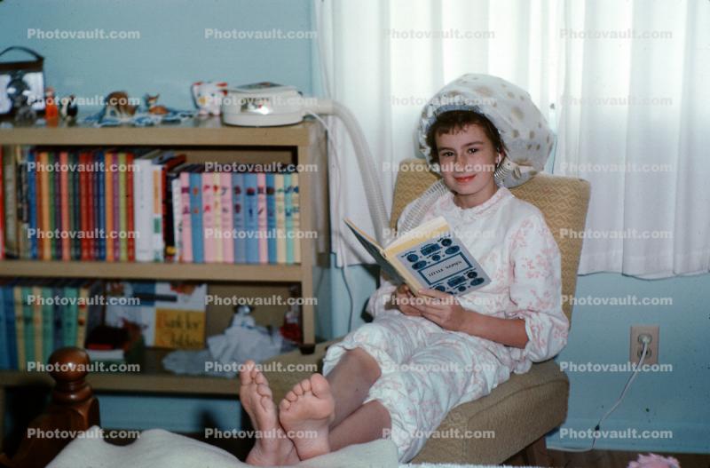 Girl curling hair, dryer, reading book Little Women, books, Pajama, bare feet, January 1964, 1960s