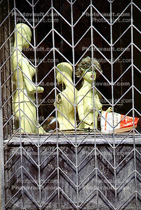 Mannequins in a cage