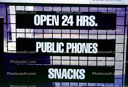 Public Phones, Snacks, open 24 hours, sign