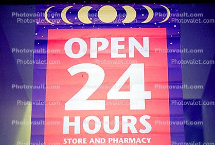 store and pharmacy, open 24 hours, sign
